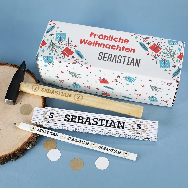 Weihnachtsgeschenk für Heimwerker mit Box, Hammer, Zollstock und Bleistift